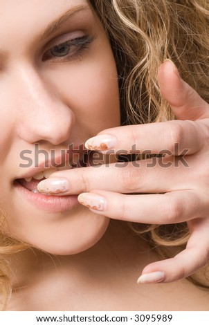 Lovely girl iasting something on tip of finger
