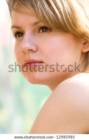 Natural blond thinking close-up portrait