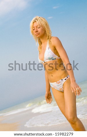 Nice girl at sea beach may be used as advertising for travel agency