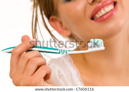 Beautiful girl with tooth-brush isolated over white