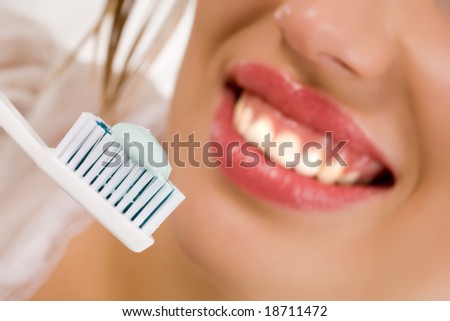 Beautiful girl with tooth-brush isolated over white