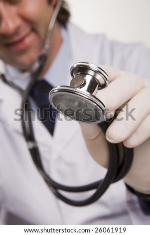 Smiling medical doctor with stethoscope. Isolated over white background