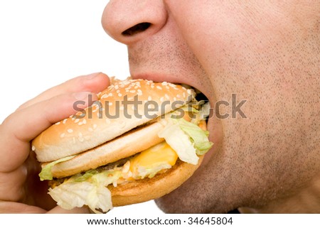 Man biting hamburger macro over white
