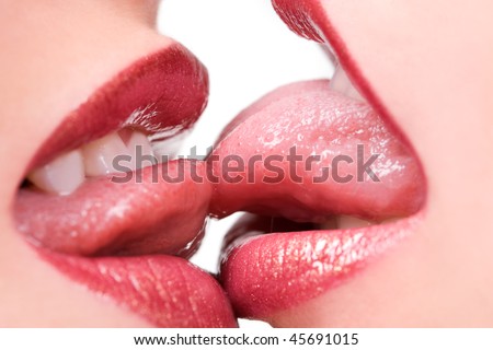 Beautiful female lovers kissing with tongues out