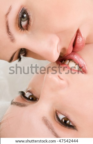 Two sensual female lovers kissing