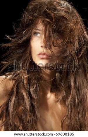 Portrait of pretty young woman with great fly-away hair