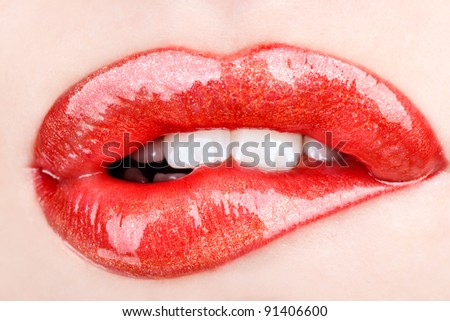 Biting her red lips teeth