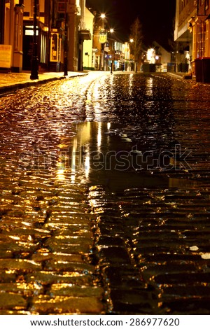 Cobbled street night rain