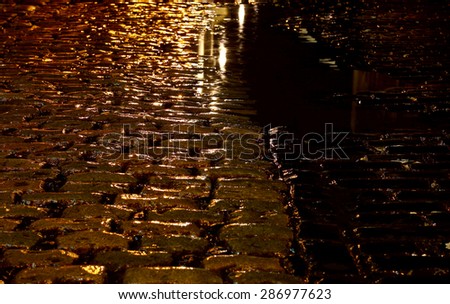 Cobbled street night rain
