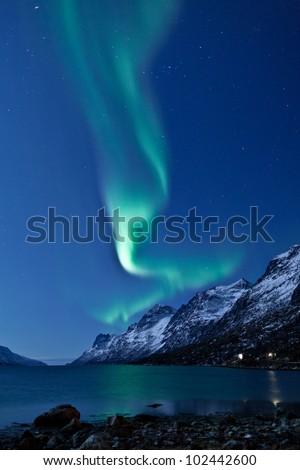Aurora Borealis in Norway reflecting in the water
