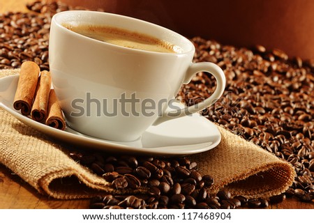 Composition with white cup of coffee
