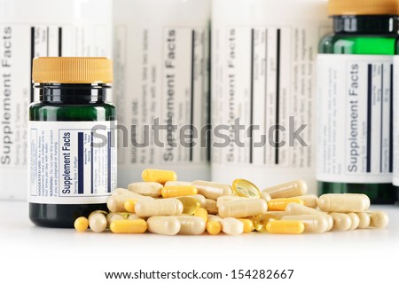 Composition with dietary supplement capsules. Drug pills