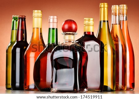 Bottles of assorted alcoholic beverages including beer and wine