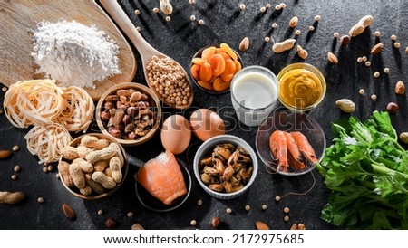 Composition with common food allergens including egg, milk, soya, nuts, fish, seafood, wheat flour, mustard, dried apricots and celery Сток-фото © 