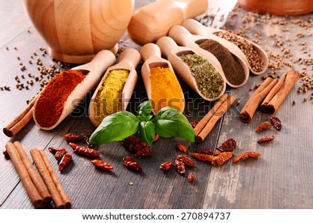 Variety of spices on kitchen table.