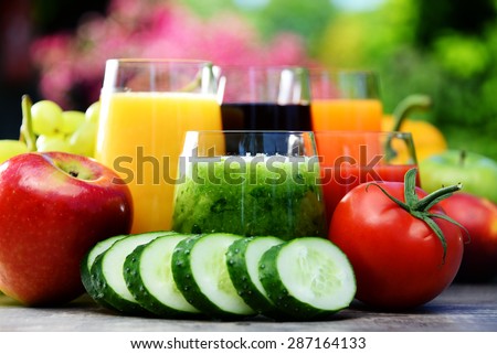 Glasses with fresh organic detox juices in the garden