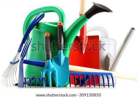 Watering cans and garden tools isolated on white background