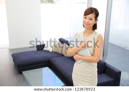 A portrait of a young business woman in an office