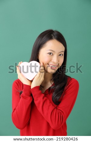 Young woman portrait hold gift in christmas color style .