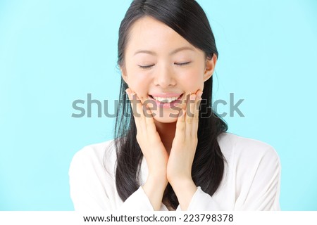 attractive asian woman skin care image isolated on blue background