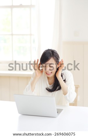 thinking Japanese woman with PC