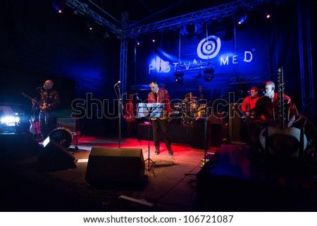 LOULE, PORTUGAL - JUNE 29: A Curva da Cintura  performs onstage in a world music festival at festival med on June 29, 2012 in Loule, Portugal.