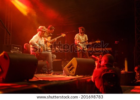 LOULE - JUNE 27: Moroccan instrumentalist and singer Nour Eddine performs on stage at festival med, a world music festival, in Loule, Portugal, June 27, 2014