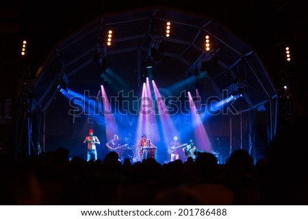 LOULE - JUNE 28: Jupiter and Okwess International a traditional music band from Rep. Dem. Congo performs on stage at festival med, a world music festival in Loule, Portugal, June 28, 2014