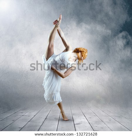 Dance element of ballerina in white dress