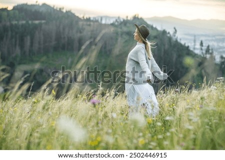 Similar – Foto Bild Frau genießt den Sonnenuntergang an einem schönen Strand.