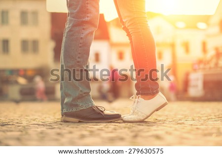 Couples foots stay at the street under sunlight