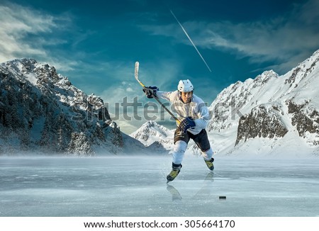 Ice hockey player in action outdoor around mountains