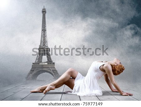 Woman dancer seating posing on the Eifel tower background