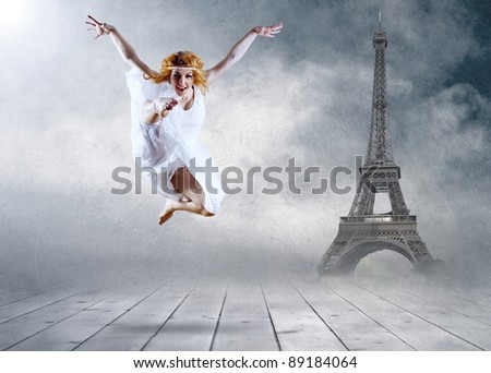 Woman dancer seating posing on the Eifel tower background