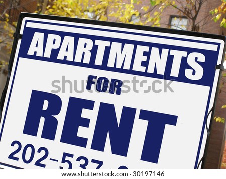 For rent sign in front of apartment building.