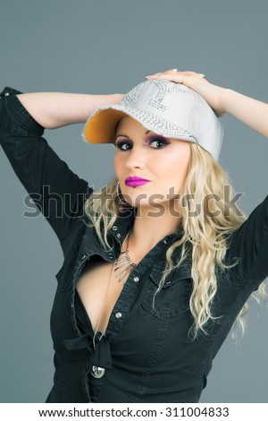 white rapper blond girl poses in studio
