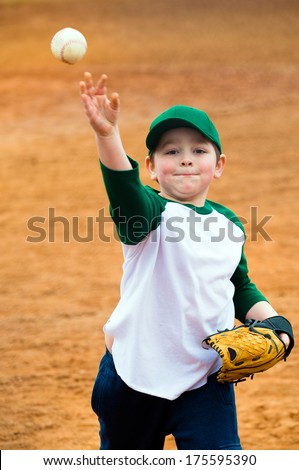 Boy throws baseball during practice