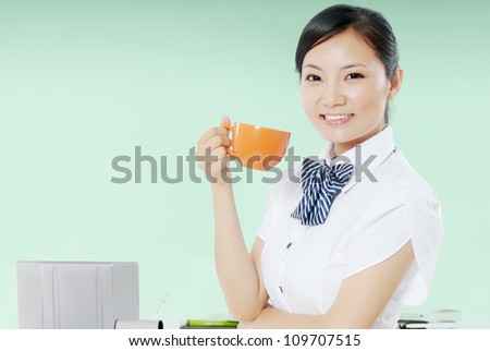 business woman give you a cup of coffee in office.
