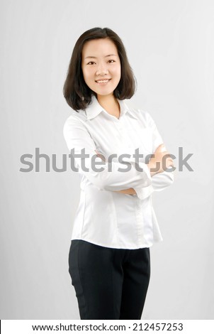 Self-confidence mature career women.Standing in front of a white background.