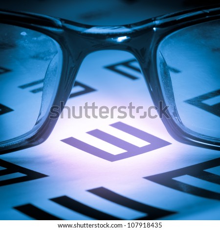 medical eye chart and glasses
