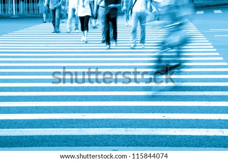 Pedestrians crowd in city street abstract blur