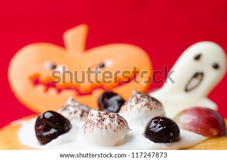 Halloween cake with pumpkin red holiday background