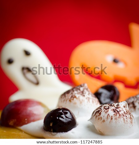 Halloween cake with pumpkin red holiday background