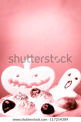 Halloween cake with pumpkin pink background