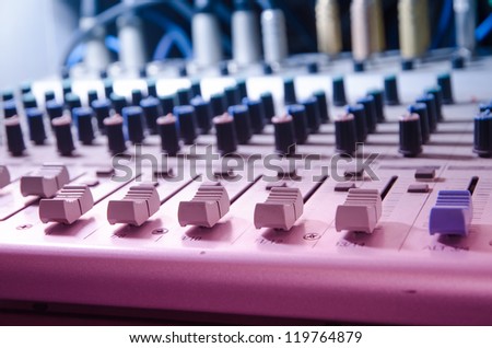sound studio adjusting record equipment