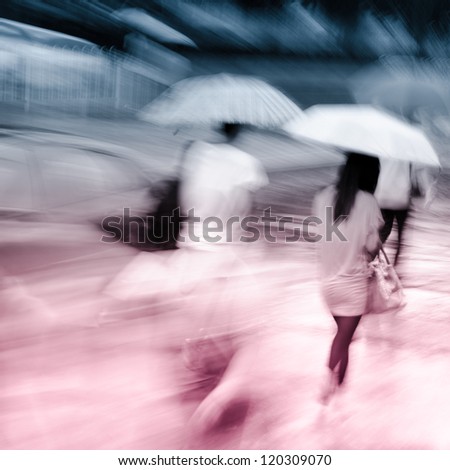 big city people walk on road in rainy day, blured motion abstract background.