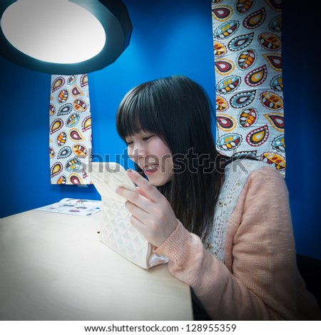 Young Asian woman look into the mirror with shopping bags