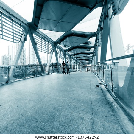 people walking on modern urban city platform bridge,blur motion.