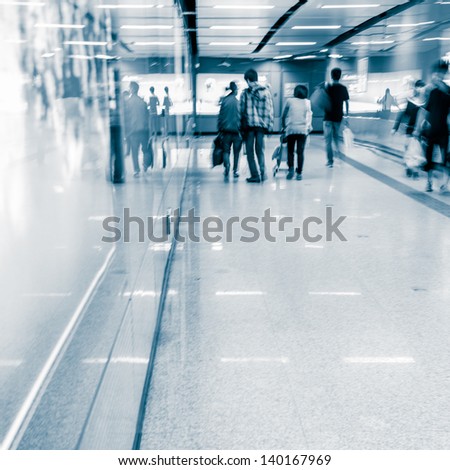 business people crowd walk at subway station abstract blurred motion
