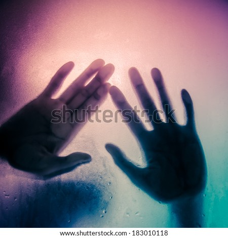 silhouette of hand with glass black and white